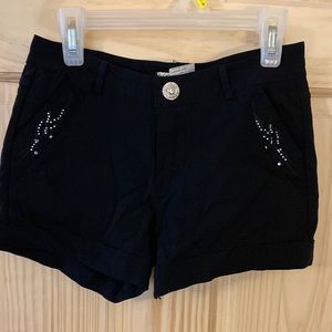 Black bedazzled short shorts.